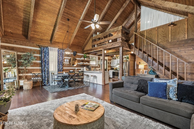 living area featuring wooden ceiling, wood-type flooring, wood walls, and high vaulted ceiling