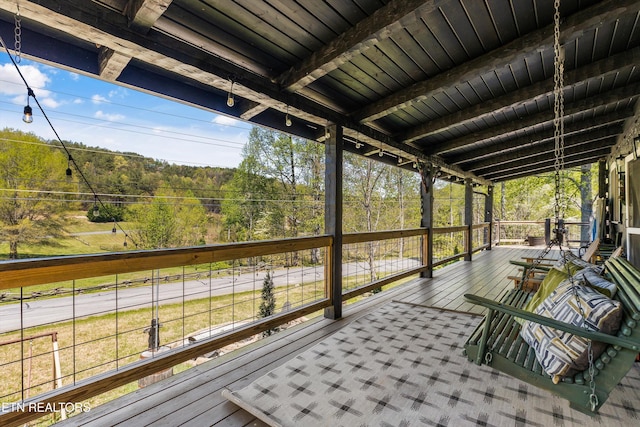 deck featuring a wooded view