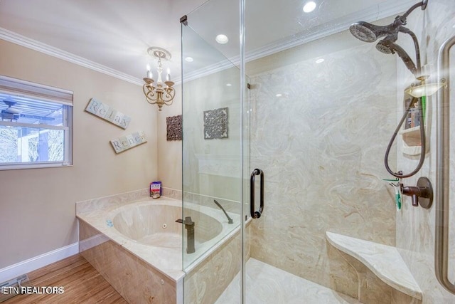 full bathroom featuring crown molding, an inviting chandelier, baseboards, a bath, and a stall shower