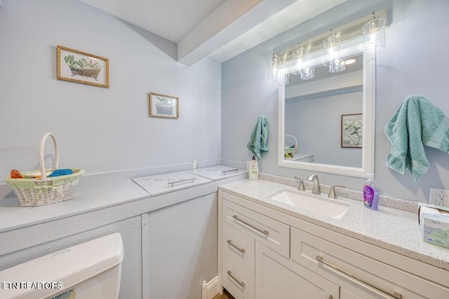 bathroom with vanity and toilet