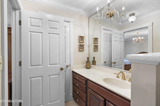 145 Lynn Ave, Jellico, TN 37762 - ensuite bathroom featuring a textured ceiling, vanity, a chandelier, ornamental molding, and ensuite bath