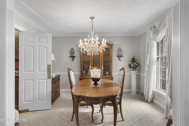 145 Lynn Ave, Jellico, TN 37762 - dining area with baseboards, a chandelier, and light colored carpet