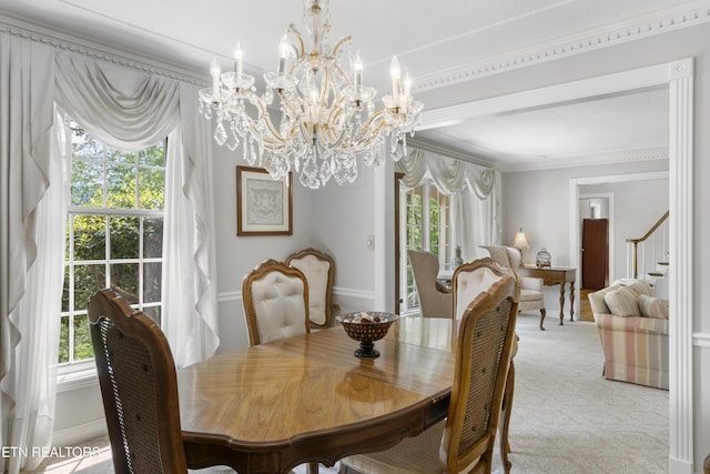 145 Lynn Ave, Jellico, TN 37762 - dining room featuring crown molding, a notable chandelier, light carpet, stairs, and baseboards