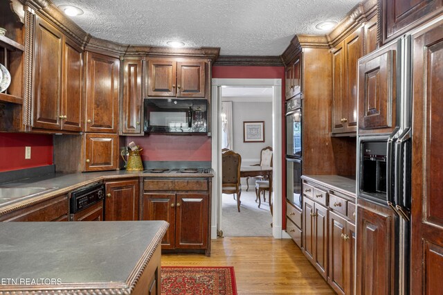 145 Lynn Ave, Jellico, TN 37762 - kitchen with open shelves, light wood finished floors, a textured ceiling, and black appliances