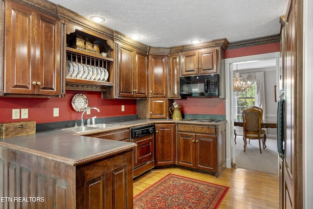 145 Lynn Ave, Jellico, TN 37762 - kitchen with a textured ceiling, black microwave, open shelves, a sink, and a peninsula