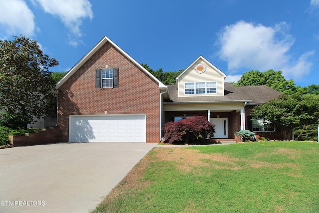13177 Clear Ridge Rd, Knoxville, TN 37922 - traditional-style home with an attached garage, concrete driveway, brick siding, and a front lawn