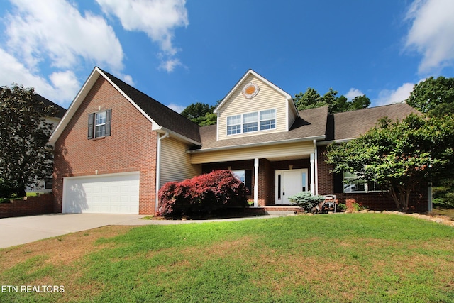 13177 Clear Ridge Rd, Knoxville, TN 37922 - view of front of home featuring an attached garage, driveway, brick siding, a front yard, and a porch