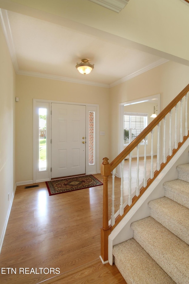 13177 Clear Ridge Rd, Knoxville, TN 37922 - entryway with light wood-style floors, healthy amount of natural light, ornamental molding, stairway, and baseboards