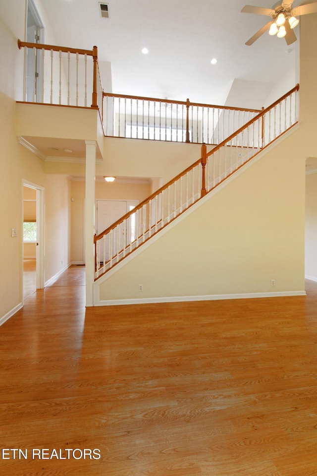13177 Clear Ridge Rd, Knoxville, TN 37922 - unfurnished living room with a towering ceiling, a ceiling fan, wood finished floors, recessed lighting, and baseboards