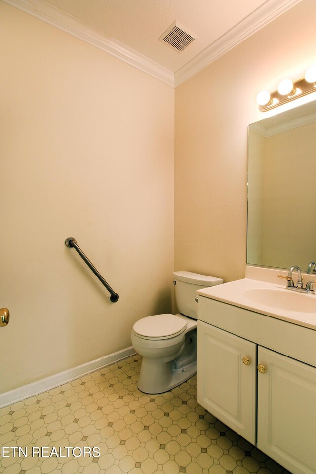 13177 Clear Ridge Rd, Knoxville, TN 37922 - bathroom featuring crown molding, toilet, vanity, tile patterned floors, and baseboards