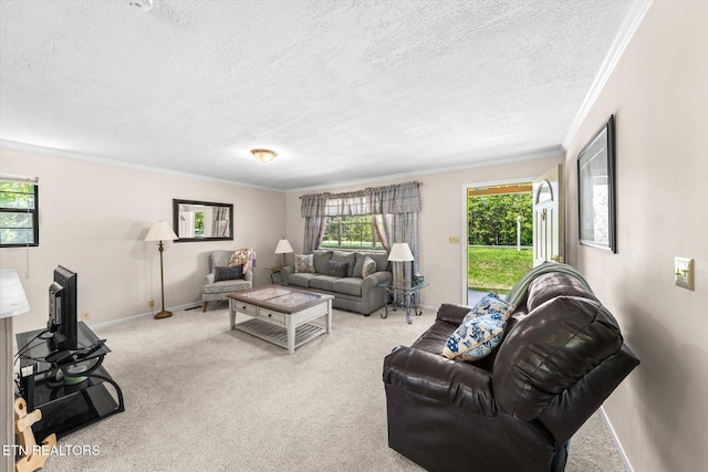 living room featuring baseboards, ornamental molding, plenty of natural light, and carpet flooring