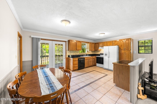kitchen with crown molding, black dishwasher, white refrigerator with ice dispenser, electric range oven, and a sink