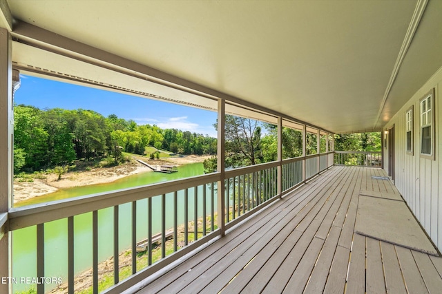wooden terrace with a water view