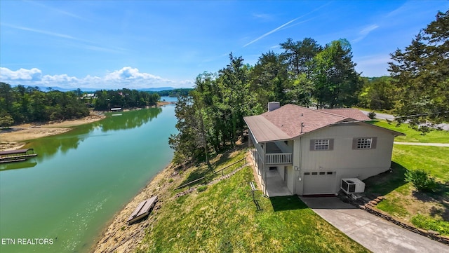 drone / aerial view featuring a water view