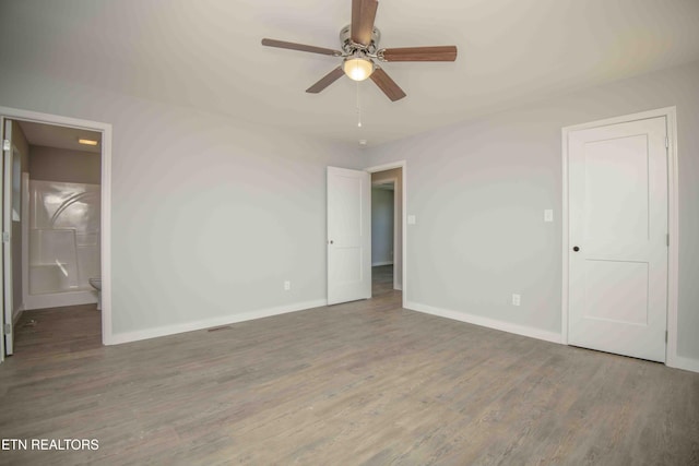 3336 Wimpole Ave, Knoxville, TN 37914 - unfurnished bedroom with baseboards, ceiling fan, wood finished floors, and connected bathroom