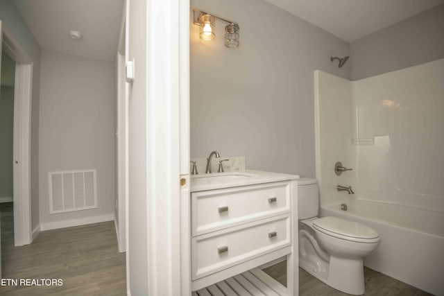 3336 Wimpole Ave, Knoxville, TN 37914 - full bathroom featuring visible vents, vanity, wood finished floors, toilet, and shower / bath combination
