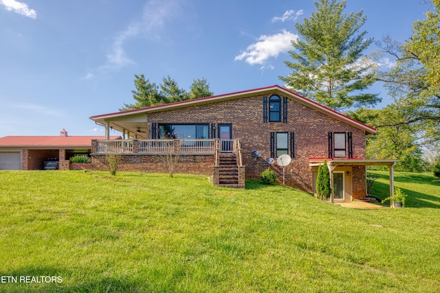 back of house with brick siding, a garage, a wooden deck, stairway, and a lawn