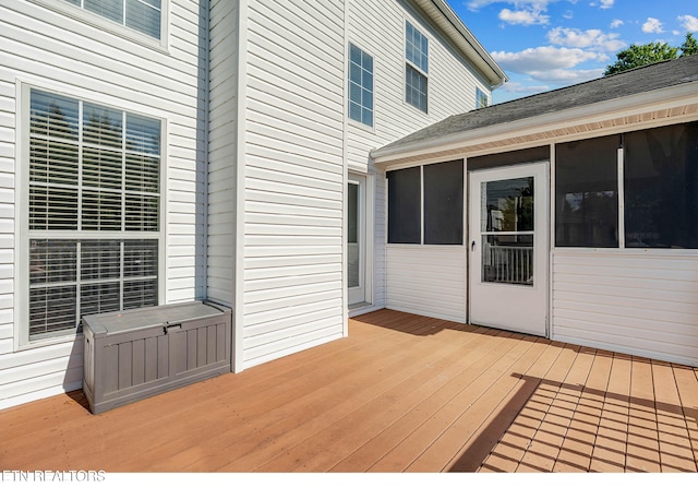 deck with a sunroom