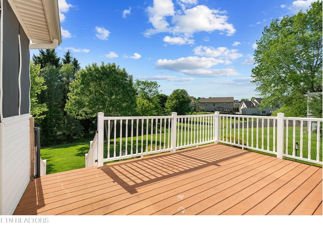 deck featuring a lawn