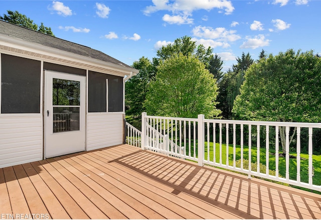 deck with a sunroom