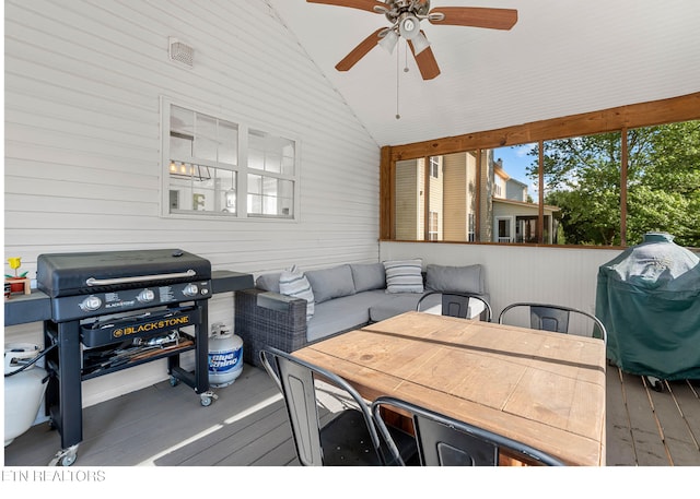 deck with an outdoor living space, outdoor dining area, ceiling fan, and area for grilling