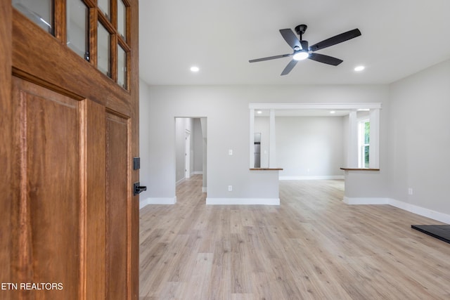 unfurnished living room with recessed lighting, baseboards, a ceiling fan, and light wood finished floors