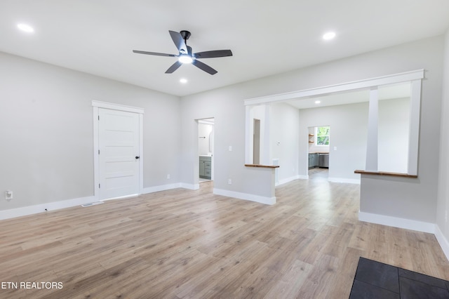 unfurnished living room with visible vents, baseboards, ceiling fan, recessed lighting, and light wood finished floors