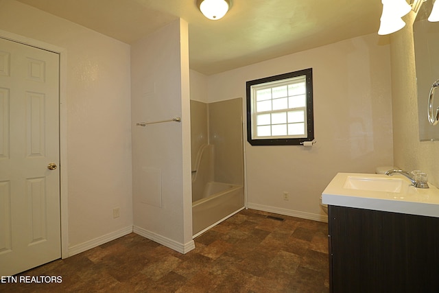 bathroom featuring baseboards, stone finish flooring, visible vents, vanity, and shower / bathing tub combination