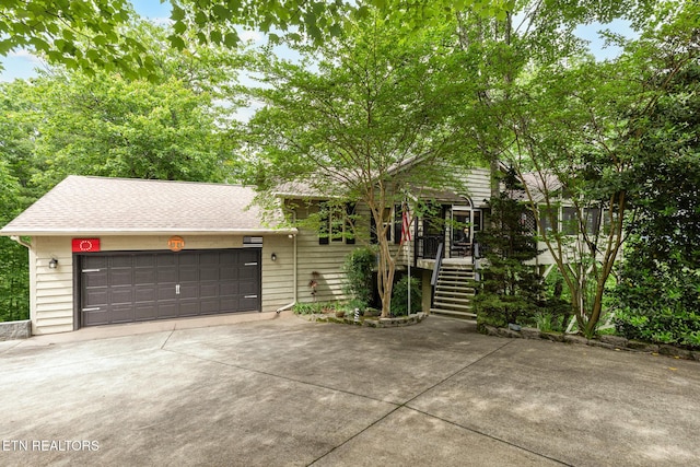 620 Hawk View Dr, Townsend, TN 37882 - view of front of home with concrete driveway, stairway, a shingled roof, and a garage