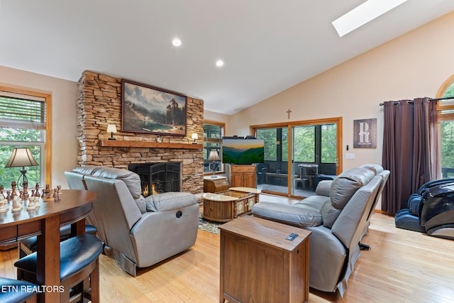 620 Hawk View Dr, Townsend, TN 37882 - living room featuring a fireplace, light wood-style floors, plenty of natural light, high vaulted ceiling, and recessed lighting