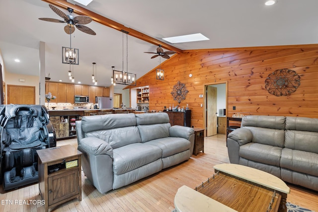 620 Hawk View Dr, Townsend, TN 37882 - living area featuring a ceiling fan, a skylight, wooden walls, light wood-style flooring, and recessed lighting