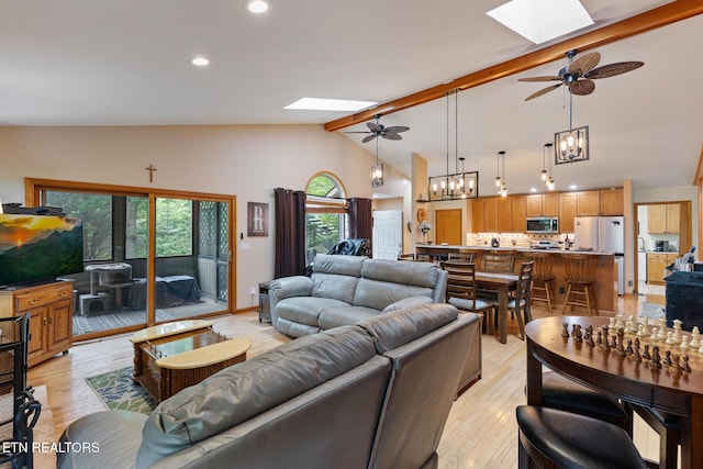 620 Hawk View Dr, Townsend, TN 37882 - living room featuring a skylight, a ceiling fan, a chandelier, beamed ceiling, and recessed lighting