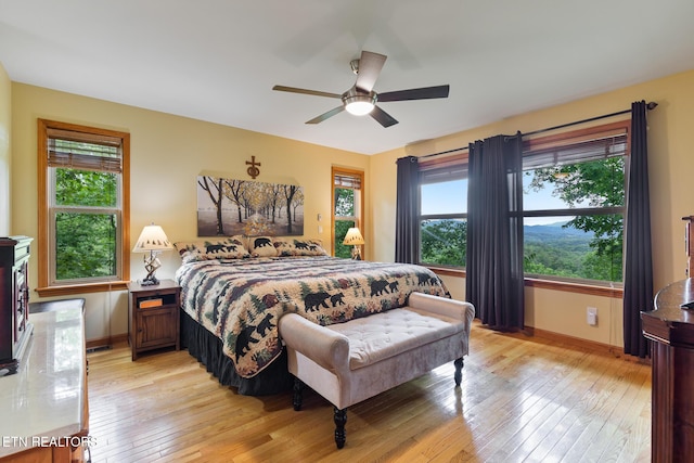 620 Hawk View Dr, Townsend, TN 37882 - bedroom with light wood-style flooring, baseboards, and ceiling fan