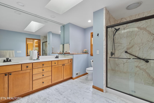 620 Hawk View Dr, Townsend, TN 37882 - bathroom with a skylight, marble look tiles, toilet, a marble finish shower, and double vanity