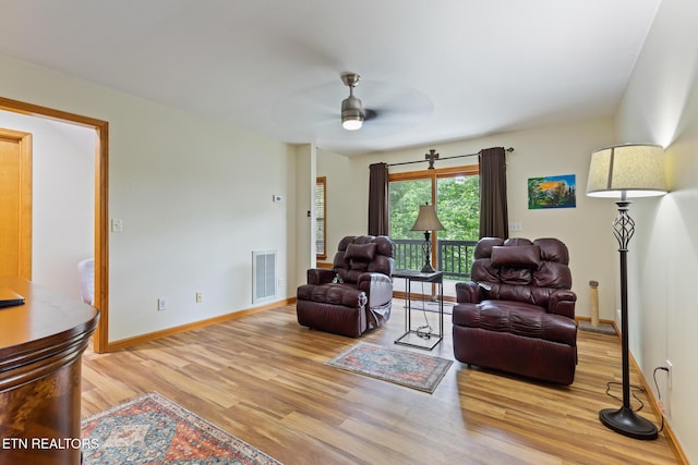 620 Hawk View Dr, Townsend, TN 37882 - living room featuring wood finished floors, a ceiling fan, and baseboards