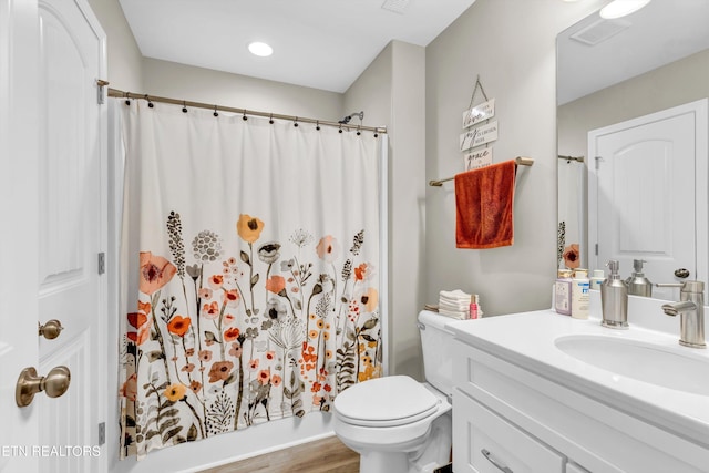 full bath with vanity, visible vents, wood finished floors, toilet, and a shower with curtain