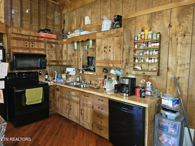 728 Essary Rd, Tazewell, TN 37879 - kitchen with black appliances, a sink, wood walls, light countertops, and brown cabinets