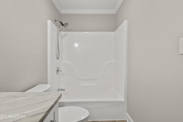 full bathroom featuring toilet, shower / tub combination, ornamental molding, and vanity