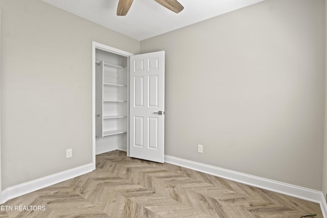 unfurnished bedroom featuring baseboards and ceiling fan