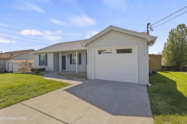 ranch-style house with driveway, a garage, fence, a shed, and a front lawn