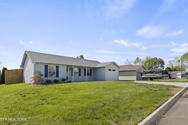 single story home featuring fence, an attached garage, driveway, and a front lawn