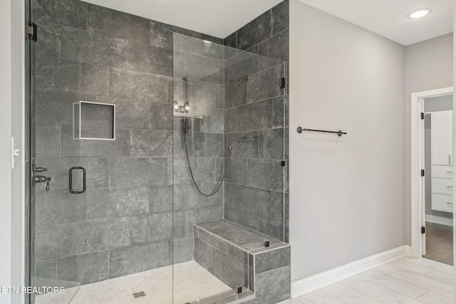 bathroom with recessed lighting, baseboards, marble finish floor, and a stall shower