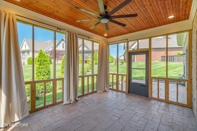 unfurnished sunroom featuring wood ceiling and french doors