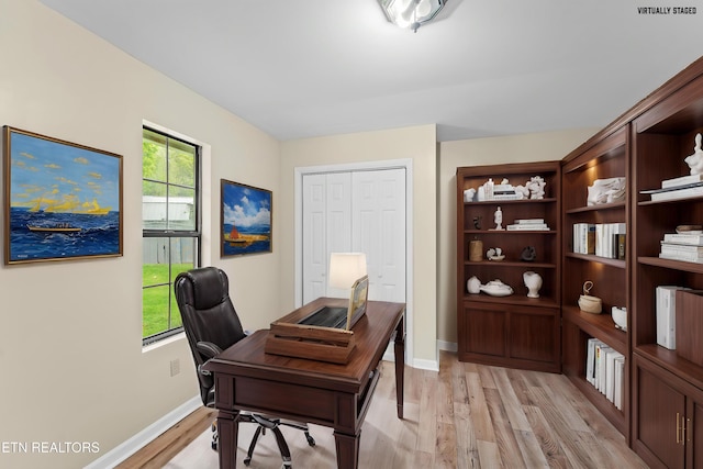 office featuring light wood finished floors and baseboards