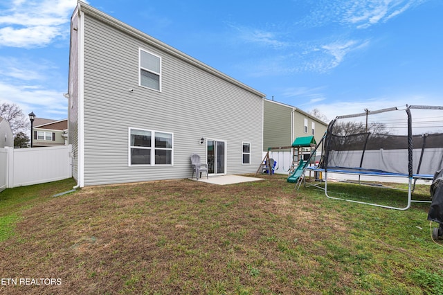 5518 English Holly Way, Knoxville, TN 37914 - back of house with a trampoline, a patio area, fence, and a yard