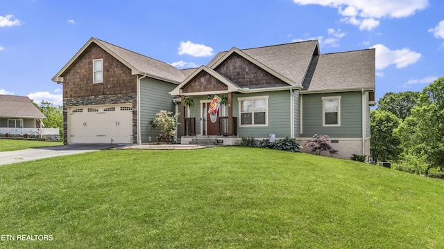 craftsman-style home with an attached garage, driveway, and a front yard