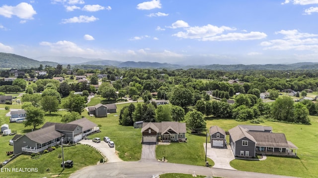 birds eye view of property featuring a mountain view