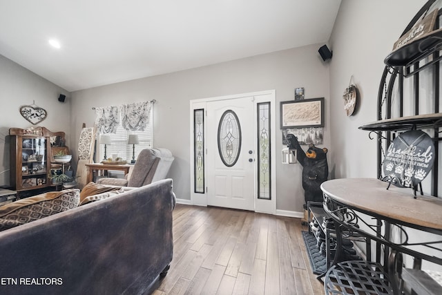 living room with baseboards and hardwood / wood-style flooring