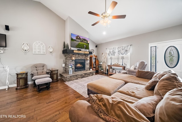living area with a fireplace, baseboards, ceiling fan, high vaulted ceiling, and hardwood / wood-style flooring