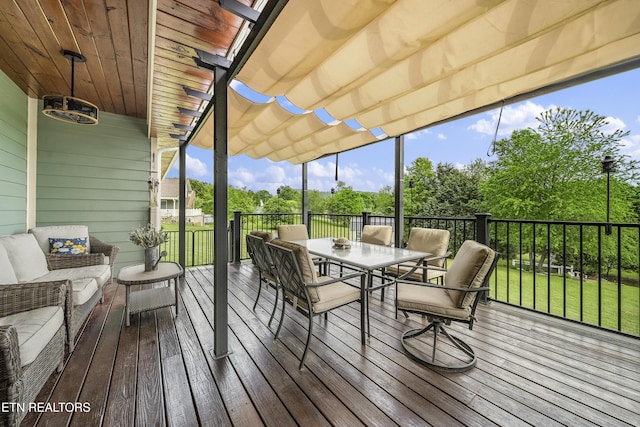 wooden deck featuring outdoor dining area and a pergola
